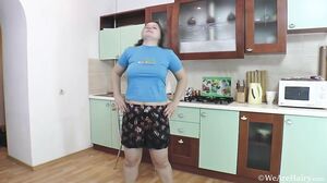 Adelina puts on a sexy stripping in the kitchen